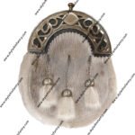 This Dress sporran is made from Seal Skin with 3 matching capped tassels on antique finish chains. It features an antique finish cantle beautifully enhanced with an open work Celtic design with a plain oval in the centre. This is the perfect sporran to compliment your Wedding outfit or for a Formal Black Tie event or simply give as a gift to someone special.